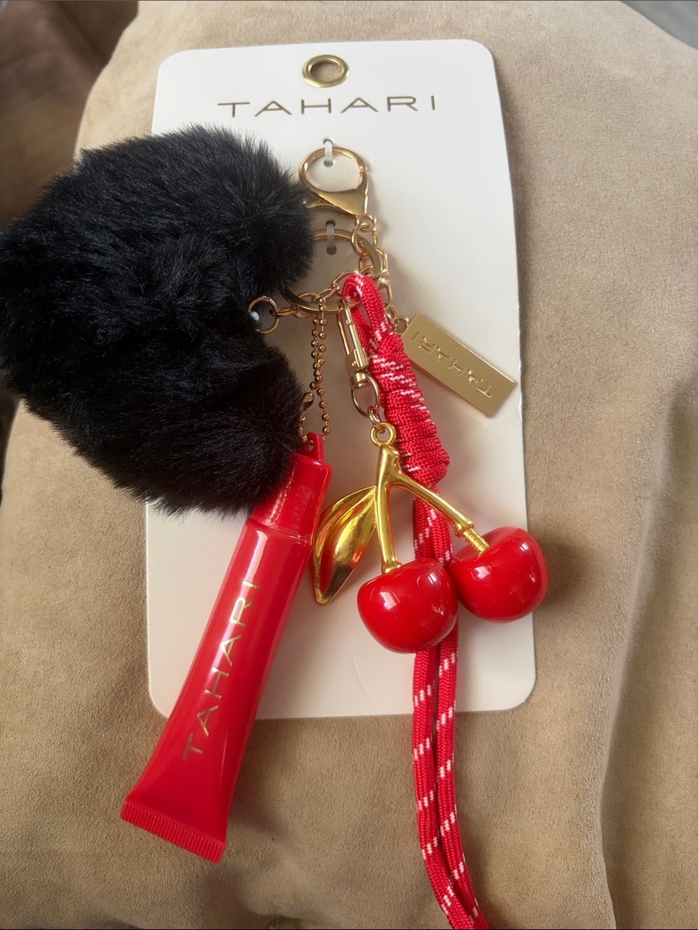 Tahari Black Pom Pom Keychain with Red Cherry & Lip Gloss Charm